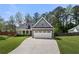 Charming two-story home with stone accents, an attached two-car garage, and well-manicured landscaping at 2232 Ann Ln, Lithia Springs, GA 30122