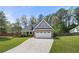 Charming two-story home with stone accents, a well-manicured lawn, and an attached two-car garage at 2232 Ann Ln, Lithia Springs, GA 30122