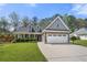 Charming two-story home with stone accents, a well-manicured lawn, and an attached two-car garage at 2232 Ann Ln, Lithia Springs, GA 30122