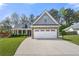 Charming two-story home with stone accents, a well-manicured lawn, and an attached two-car garage at 2232 Ann Ln, Lithia Springs, GA 30122
