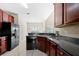 Kitchen with black appliances and ample cabinet space at 2232 Ann Ln, Lithia Springs, GA 30122