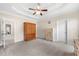 Large primary bedroom features tray ceiling, neutral carpet, and walk-in closet at 2232 Ann Ln, Lithia Springs, GA 30122