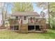 Home with a raised deck and backyard brick barbecue, perfect for outdoor entertaining and relaxing at 2460 Constance St, East Point, GA 30344