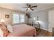 Bedroom boasting hardwood floors, large windows, a ceiling fan, and modern decor at 2460 Constance St, East Point, GA 30344