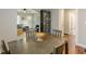 The open dining room features an archway leading to the living room, hardwood floors, and decorative floral display at 2460 Constance St, East Point, GA 30344