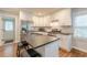 Bright kitchen featuring an island, stainless steel appliances, and plenty of natural light from the door to the backyard at 2460 Constance St, East Point, GA 30344