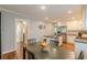 Open kitchen and dining area featuring modern appliances, a central island, and ample cabinet space at 2460 Constance St, East Point, GA 30344
