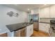 Bright kitchen showcasing stainless steel appliances, modern countertops, and white cabinets, offering a clean aesthetic at 2460 Constance St, East Point, GA 30344