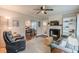 Comfortable living room featuring a fireplace, hardwood floors, and abundant natural light at 2460 Constance St, East Point, GA 30344