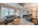 Bright living room boasting hardwood floors, large windows, and neutral decor at 2460 Constance St, East Point, GA 30344