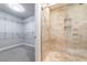 This primary bath features a glass enclosed shower and opens to a large walk-in closet at 2626 Peachtree Nw Rd # 412, Atlanta, GA 30305