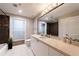 Stylish bathroom with modern vanity, tile floor, and decorative accent wall in the shower area at 2626 Peachtree Nw Rd # 412, Atlanta, GA 30305