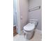 This bathroom features an upgraded toilet, towel bar, and access to walk-in closet at 2626 Peachtree Nw Rd # 412, Atlanta, GA 30305