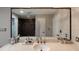 Bathroom featuring double vanity, ample counter space, and mirror reflecting shower at 2626 Peachtree Nw Rd # 412, Atlanta, GA 30305