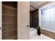 Charming bathroom features a mosaic-tiled wall above the bathtub and a storage closet with metal shelving at 2626 Peachtree Nw Rd # 412, Atlanta, GA 30305