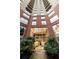 Exterior of building with glass doors, brick facade, and landscaped greenery at 2626 Peachtree Nw Rd # 412, Atlanta, GA 30305