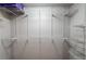 Spacious walk-in closet with customizable shelving system for organization at 2626 Peachtree Nw Rd # 412, Atlanta, GA 30305
