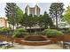 Outdoor courtyard with a fountain and relaxing seating area, surrounded by lush greenery at 2626 Peachtree Nw Rd # 412, Atlanta, GA 30305