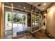 Building entrance with glass doors looking out onto a lush landscape at 2626 Peachtree Nw Rd # 412, Atlanta, GA 30305