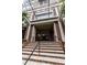 Exterior shot of building entrance with brick steps and glass awning at 2626 Peachtree Nw Rd # 412, Atlanta, GA 30305