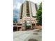 A stunning high-rise building is captured from a low angle, showcasing its brick base at 2626 Peachtree Nw Rd # 412, Atlanta, GA 30305
