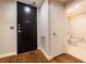 Hallway entrance to bathroom with dark door at 2626 Peachtree Nw Rd # 412, Atlanta, GA 30305