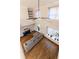Open living room with hardwood floors, gray sofa, and tall windows at 2626 Peachtree Nw Rd # 412, Atlanta, GA 30305