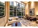 Bright lobby with floor-to-ceiling windows and comfortable seating area with stone floors at 2626 Peachtree Nw Rd # 412, Atlanta, GA 30305