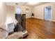 Open loft area with beautiful wood flooring, metal railing, and bright natural light at 2626 Peachtree Nw Rd # 412, Atlanta, GA 30305