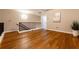 Loft area with wood floors, metal railing, neutral paint color, and views of the surrounding home at 2626 Peachtree Nw Rd # 412, Atlanta, GA 30305