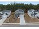 Aerial shot of modern homes with long driveways, and landscaped yards in a well-planned community at 4171 Dean Grove Way, Loganville, GA 30052
