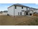 View of the home's backyard, featuring a patio and well-maintained lawn at 4171 Dean Grove Way, Loganville, GA 30052
