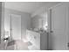 Bright and spacious bathroom featuring a double vanity and tiled flooring at 4171 Dean Grove Way, Loganville, GA 30052