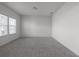 Spacious bedroom with plush carpet and plenty of natural light from windows at 4171 Dean Grove Way, Loganville, GA 30052