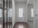 Bright entryway featuring hardwood floors and decorative mirror at 4171 Dean Grove Way, Loganville, GA 30052
