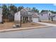 Lovely two-story home with stone details, an attached two-car garage, and a neatly landscaped front yard at 4171 Dean Grove Way, Loganville, GA 30052