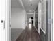 Inviting hallway with hardwood floors, leading to bright rooms in the home at 4171 Dean Grove Way, Loganville, GA 30052