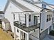 Exterior view of the house featuring a balcony with pergola and a private outdoor space at 1433 Halpern Ln, Kennesaw, GA 30144