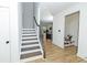 Bright foyer features hardwood floors, staircase, and a convenient built-in bench at 1433 Halpern Ln, Kennesaw, GA 30144