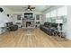 Bright living room with fireplace, hardwood floors, modern furniture, and ample natural light at 1433 Halpern Ln, Kennesaw, GA 30144