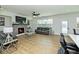 Cozy living room with a fireplace, hardwood floors, modern furniture, and a door to the backyard at 1433 Halpern Ln, Kennesaw, GA 30144