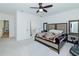 Spacious main bedroom with neutral carpeting and a ceiling fan at 1433 Halpern Ln, Kennesaw, GA 30144
