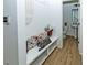 Practical mud room with a cozy bench, decorative pillows, and convenient access to a half bath at 1433 Halpern Ln, Kennesaw, GA 30144