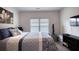 Comfortable bedroom with neutral tones, natural light, and a modern design at 164 Madison Grace Ave, Mcdonough, GA 30252