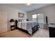 Relaxing bedroom with a calming color scheme, a large window, and a comfortable bed at 164 Madison Grace Ave, Mcdonough, GA 30252