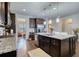 Open kitchen featuring granite countertops, stainless steel appliances, hardwood floors, and center island at 164 Madison Grace Ave, Mcdonough, GA 30252