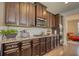 Kitchen showcasing granite countertops, stainless steel appliances, wood cabinets, and hardwood floors at 164 Madison Grace Ave, Mcdonough, GA 30252