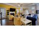 Bright living room with hardwood floors, fireplace, modern furniture, and sunny yellow walls at 164 Madison Grace Ave, Mcdonough, GA 30252