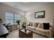 Comfortable living room with a neutral color palette, stylish decor, and ample natural light at 164 Madison Grace Ave, Mcdonough, GA 30252