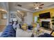 Stylish living room featuring a fireplace, hardwood floors, staircase, and colorful furniture at 164 Madison Grace Ave, Mcdonough, GA 30252